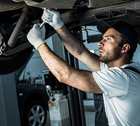 Repairman under the car repairing